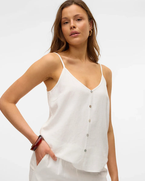 Women’s relaxed fit white camisole featuring thin straps and button-front detail for elevated casual wear.