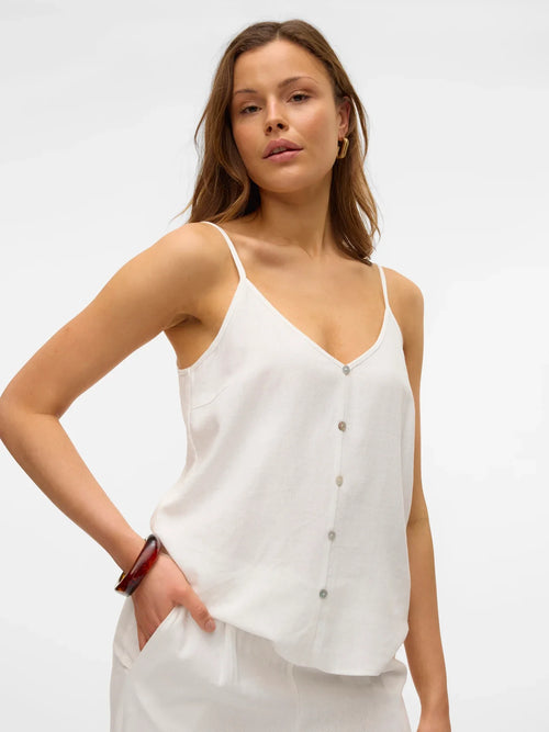 Women’s relaxed fit white camisole featuring thin straps and button-front detail for elevated casual wear.