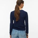 Women's classic navy button-up cardigan with fine knit texture and fitted silhouette for versatile office and weekend styling.