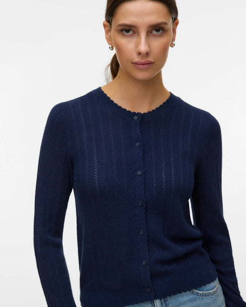 Navy blue lightweight knit cardigan with long sleeves, button front and feminine scalloped detailing for work and everyday outfits.