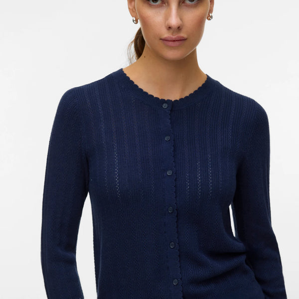 Navy blue lightweight knit cardigan with long sleeves, button front and feminine scalloped detailing for work and everyday outfits.