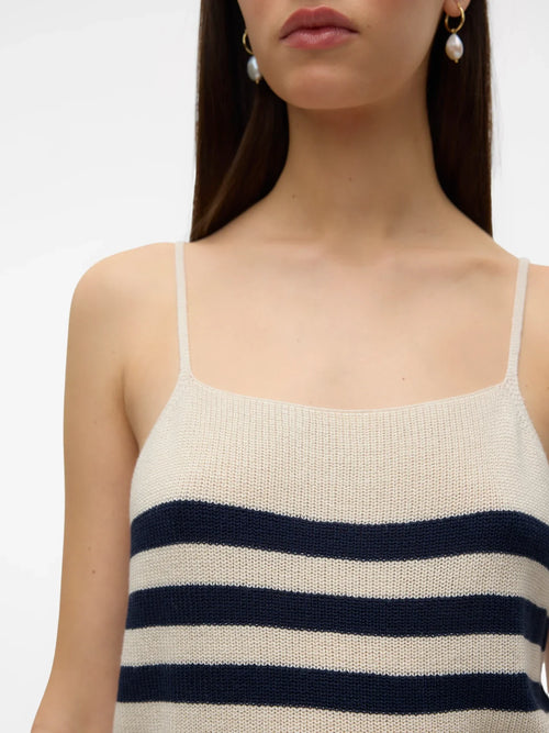 Modern nautical knit tank top featuring horizontal navy stripes and soft lightweight sweater fabric for versatile styling.