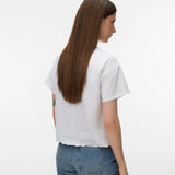 Elegant women's white short sleeve blouse with floral embroidery, crew neckline and refined everyday style for capsule wardrobes and resort wear.