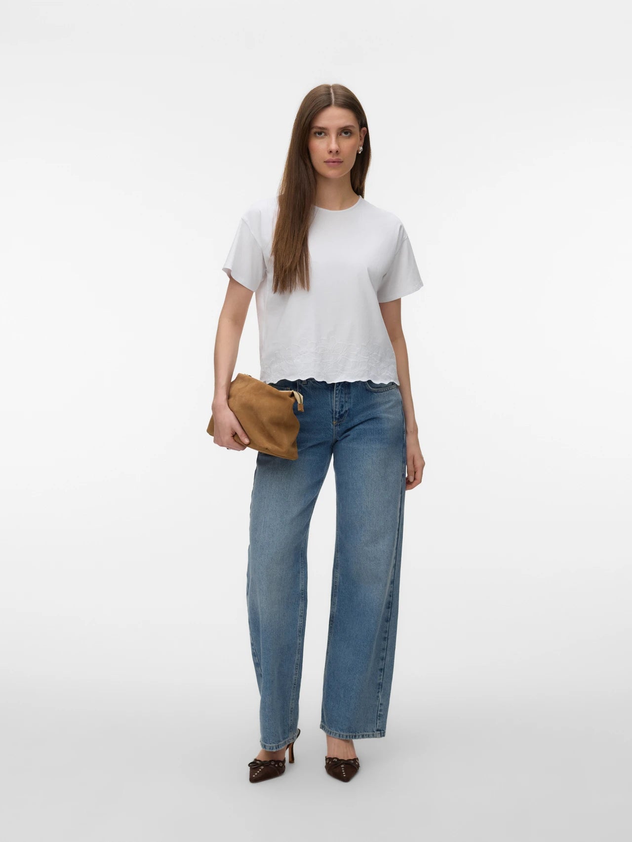 Women's white short sleeve blouse with embroidered floral hem, crew neckline and relaxed fit for elegant everyday and summer style.