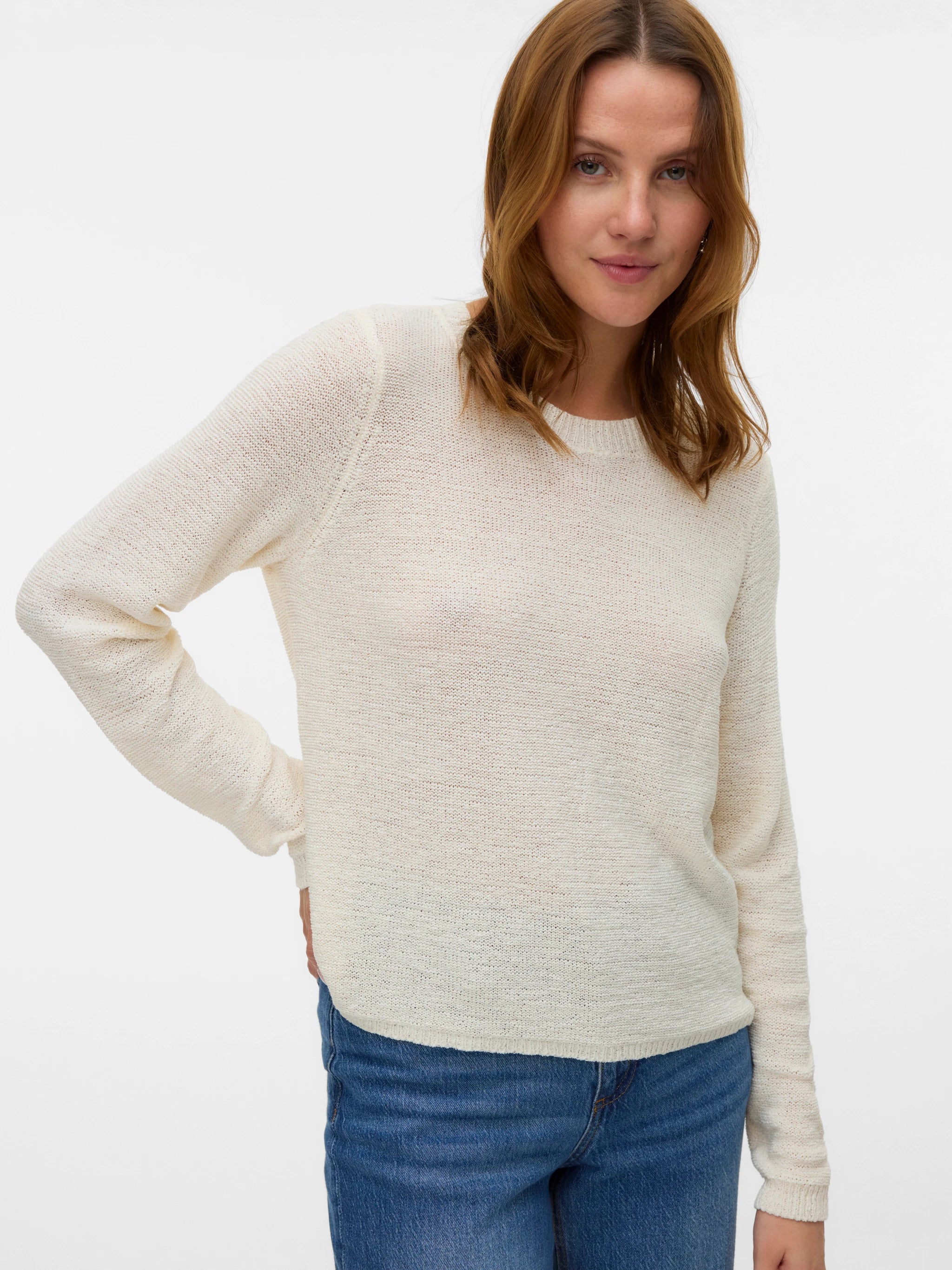 Ivory fine knit pullover sweater with long raglan sleeves and minimalist design for versatile transitional season styling.