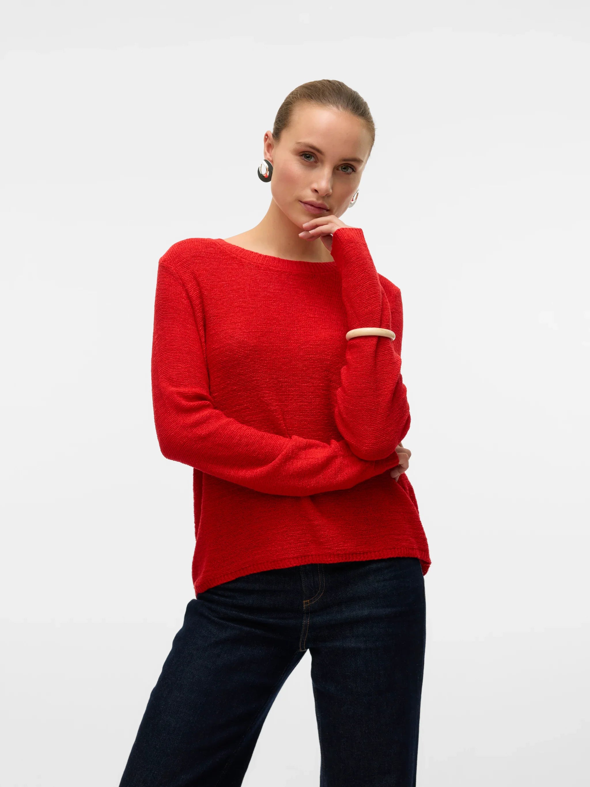 Bright red fine knit pullover sweater with long raglan sleeves and minimalist design for versatile transitional season styling.