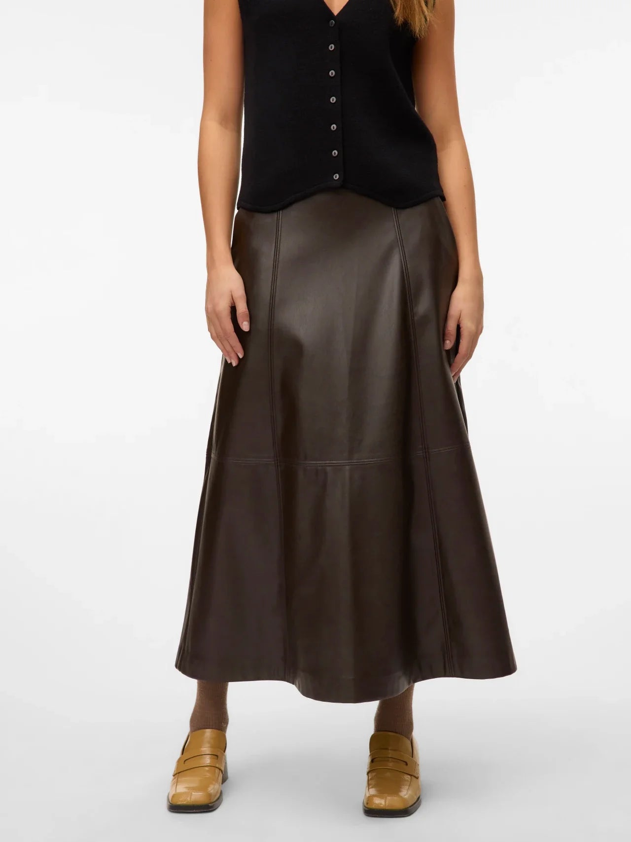 Women’s brown faux leather skirt featuring a flattering high waist and A-line midi length for elevated everyday style.