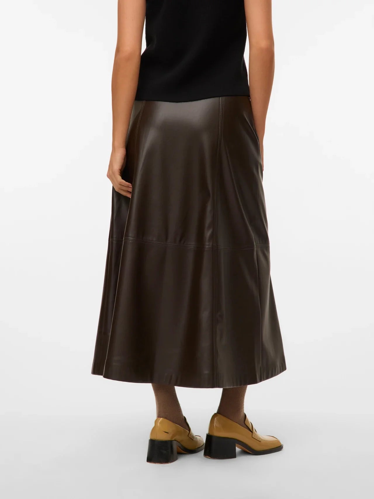 Women’s brown faux leather midi skirt with flared A-line silhouette for trendy outfits with boots and knitwear.