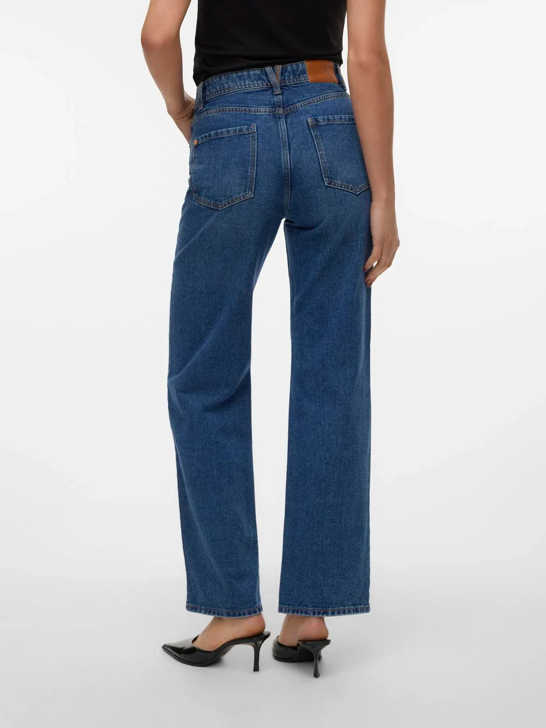 Chic wide leg blue jeans for women featuring classic five-pocket design and flattering relaxed fit for daily wear.