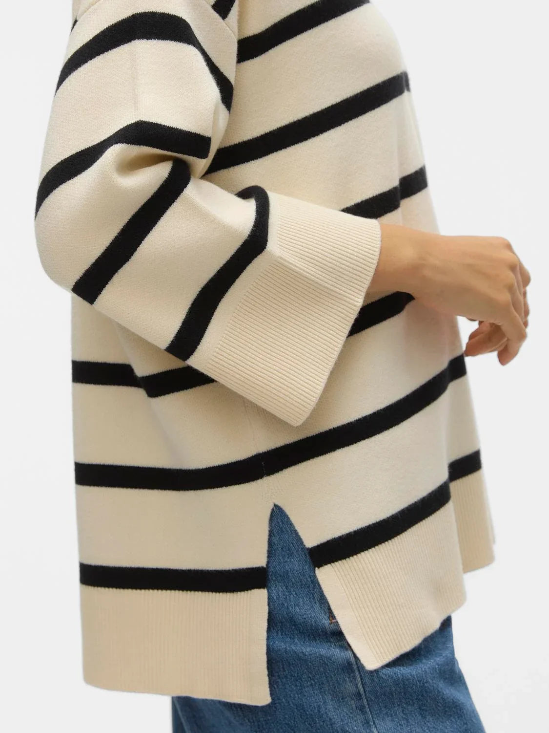 Women’s relaxed fit striped knit top with wide sleeves and classic black stripe pattern for cozy chic everyday wear.