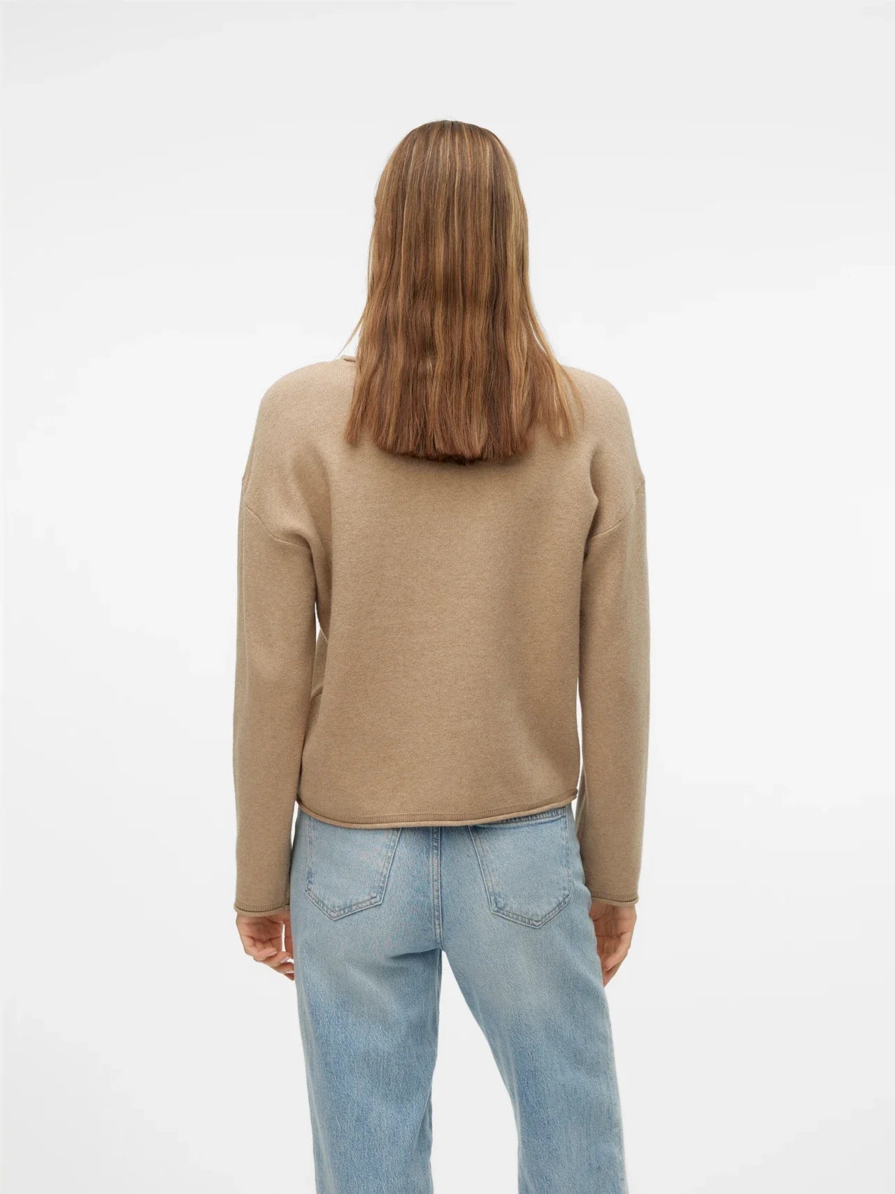 Minimalist beige long sleeve knit sweater with soft texture and elevated casual boutique fashion aesthetic.