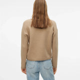 Minimalist beige long sleeve knit sweater with soft texture and elevated casual boutique fashion aesthetic.
