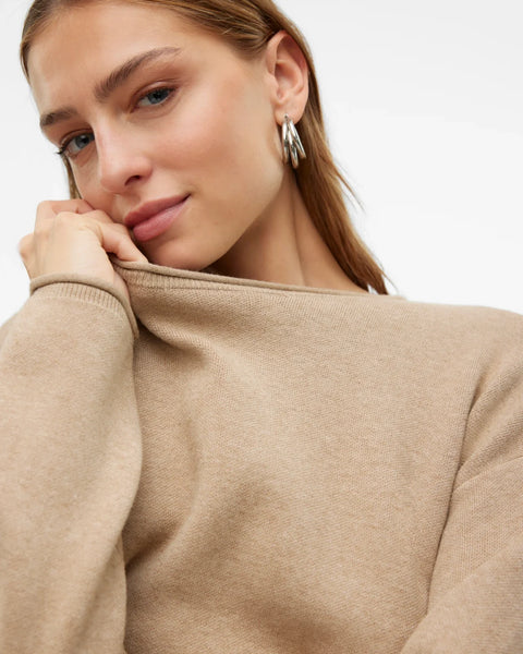 Chic relaxed-fit beige sweater for women featuring a clean neckline and soft lightweight knit texture.