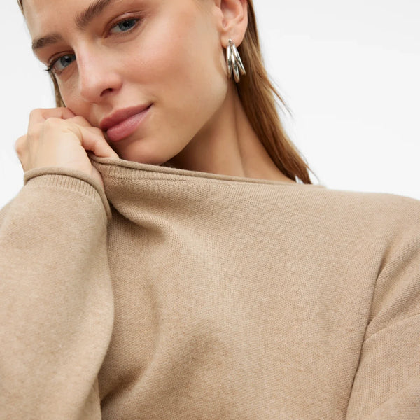 Chic relaxed-fit beige sweater for women featuring a clean neckline and soft lightweight knit texture.