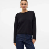 Women’s black lightweight sweater paired with vintage-inspired denim jeans for elevated casual wear.