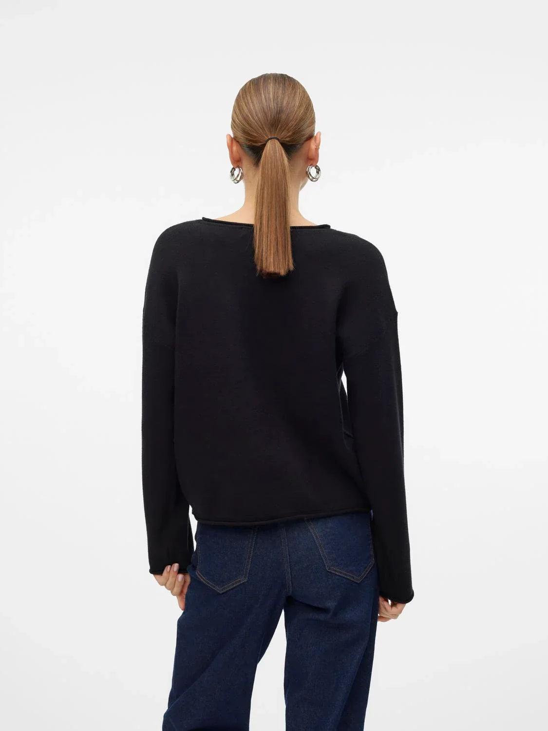 Relaxed fit women’s sweater in chic black featuring clean lines and contemporary everyday styling.