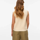 Women’s cream button-up knit vest with sleeveless silhouette for chic outfits with trousers, denim, and skirts.