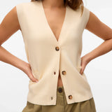 Women’s cream sweater vest with button front, V-neckline, and patch pockets for chic neutral layered outfits.