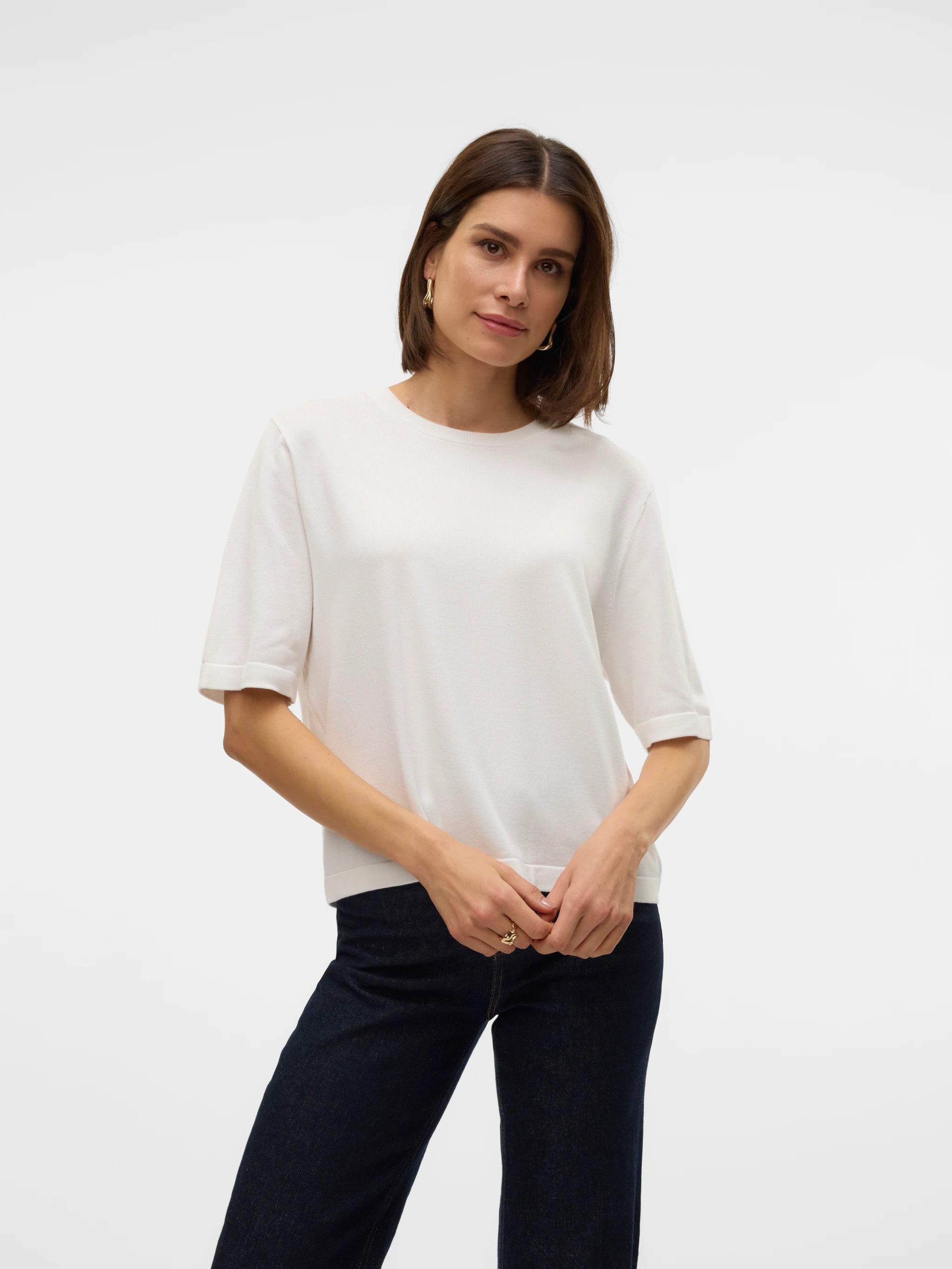 Versatile women's ivory fine knit top with crew neckline and elbow-length sleeves for sophisticated spring, summer and transitional season styling.