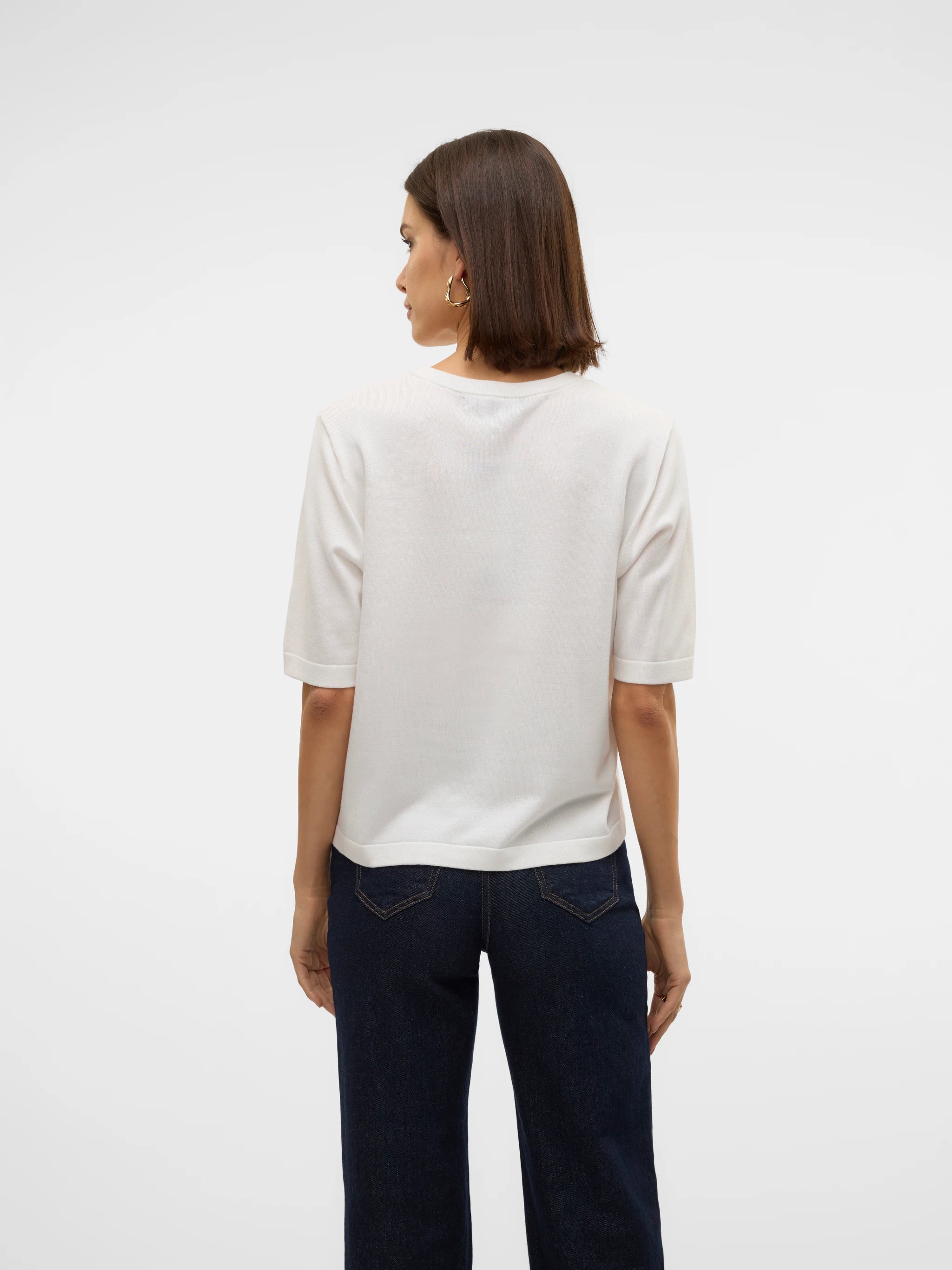Elegant ivory short sleeve sweater featuring a fine knit texture, relaxed fit and classic crew neck for sophisticated everyday outfits.