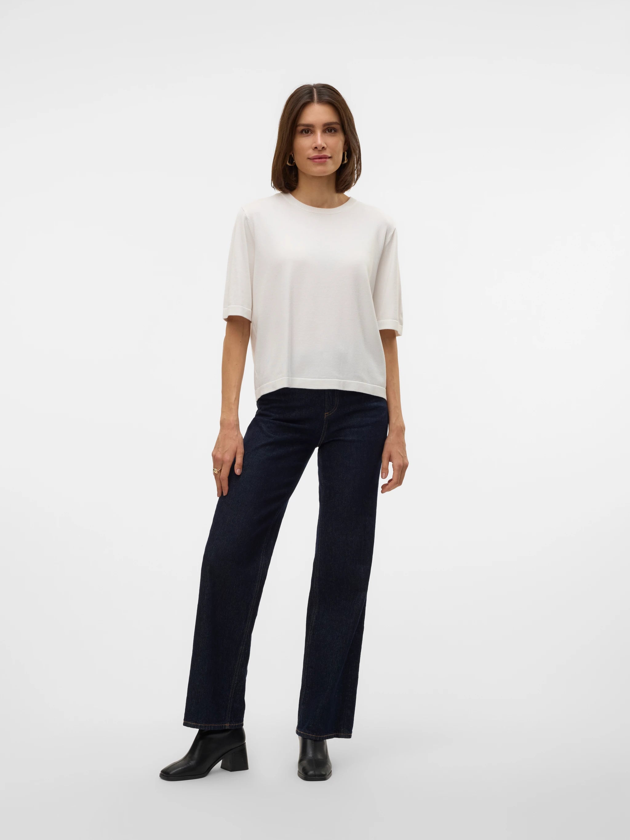 Ivory lightweight knit sweater with elbow-length sleeves, cuffed details and relaxed silhouette for work, travel and everyday wear.