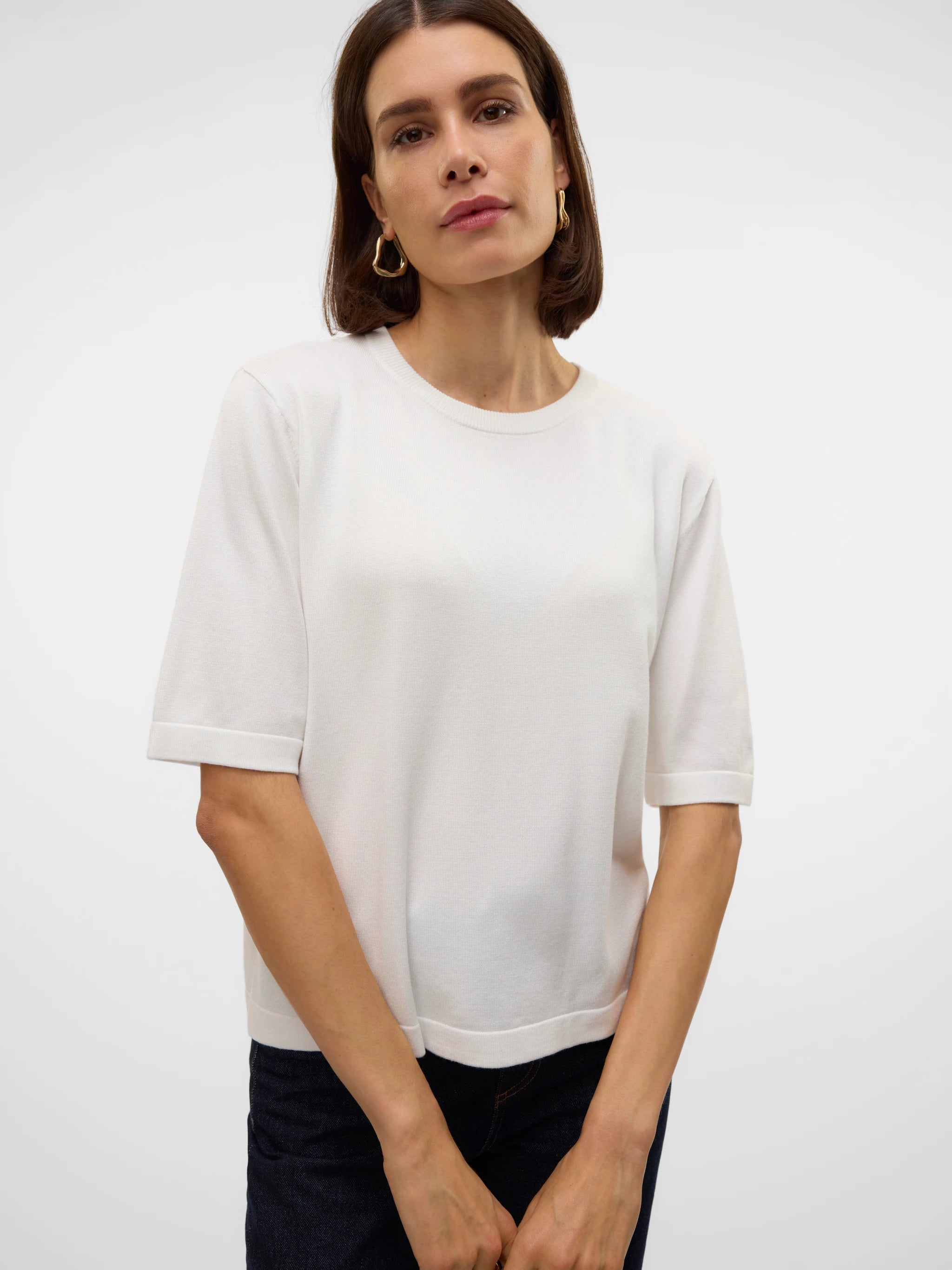 Boutique women's white fine knit sweater top with elbow sleeves and minimalist design for elevated casual, office and transitional styling.