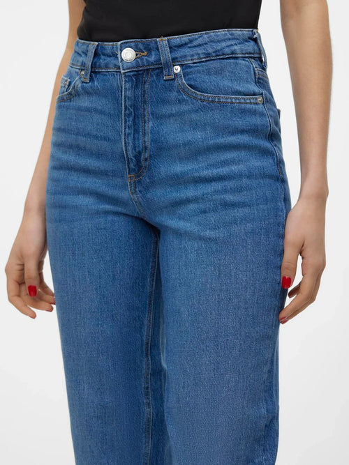 Modern medium wash jeans featuring a high-rise waist and tailored straight silhouette for everyday wear.