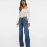 Trendy wide leg blue jeans featuring high-rise waist and effortless minimalist street-style aesthetic for women.
