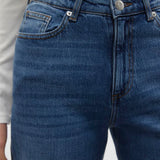 Boutique-style women’s denim jeans with relaxed straight fit and clean minimalist fashion aesthetic.