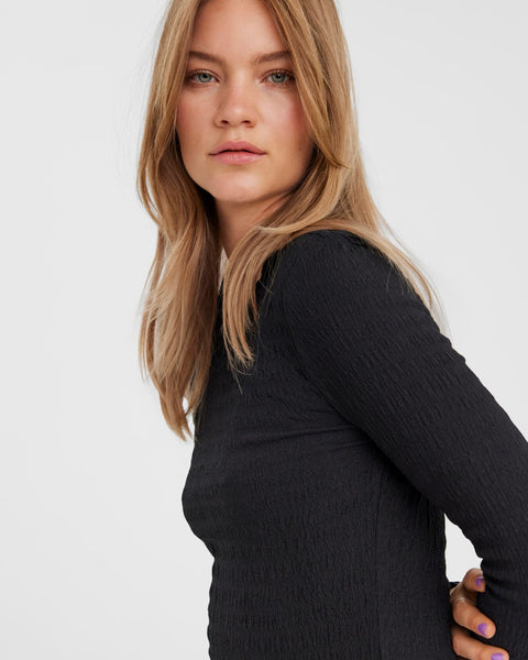Contemporary black ribbed knit shirt with streamlined silhouette and timeless style.