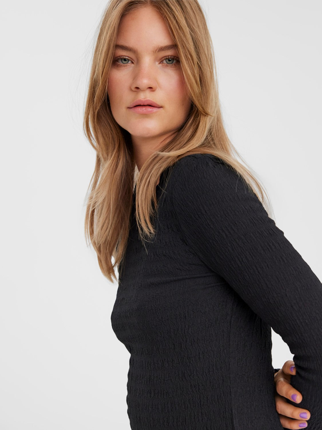Contemporary black ribbed knit shirt with streamlined silhouette and timeless style.