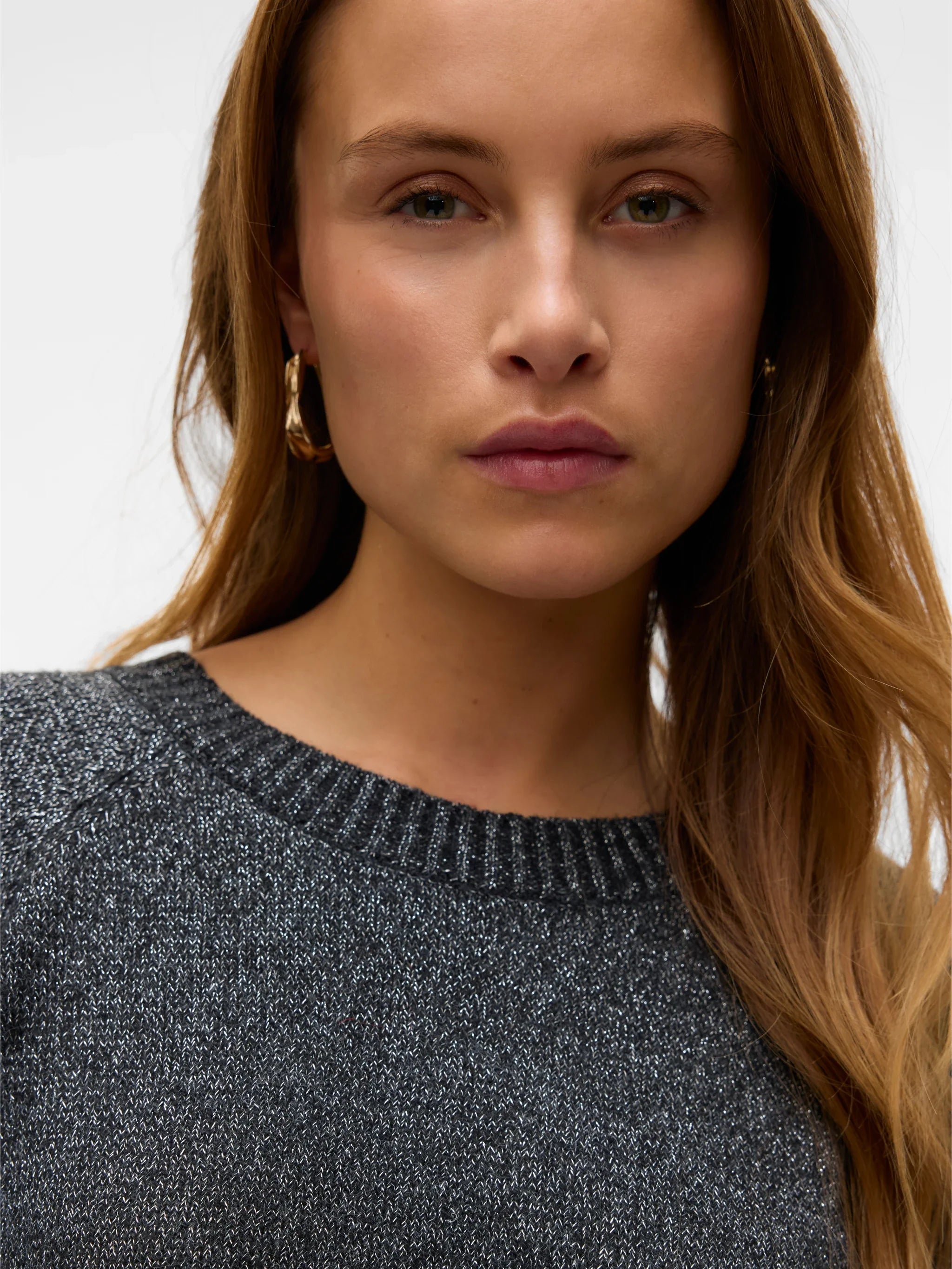 Women's charcoal grey crew neck knit sweater with long sleeves and ribbed trim for stylish everyday layering.