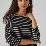 Resort cruise ship chic trendy black and white stripe knit top with effortless oversized fit and chic urban-inspired design.