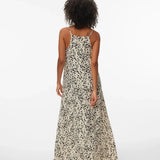 Women's lightweight black and cream spotted maxi dress featuring a flattering relaxed silhouette and effortless resort-inspired style.